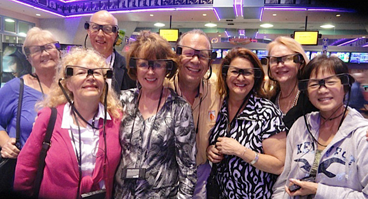 A Group of Movie Theater Patrons Wearing Accessible Caption Glasses